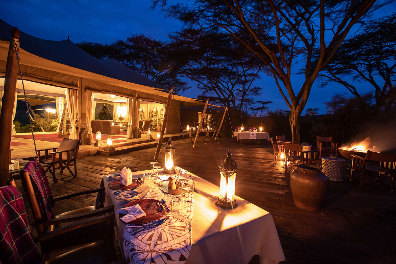 03Great-Plains-Mara-Nyika-Camp-deck-dining-at-night.jpg