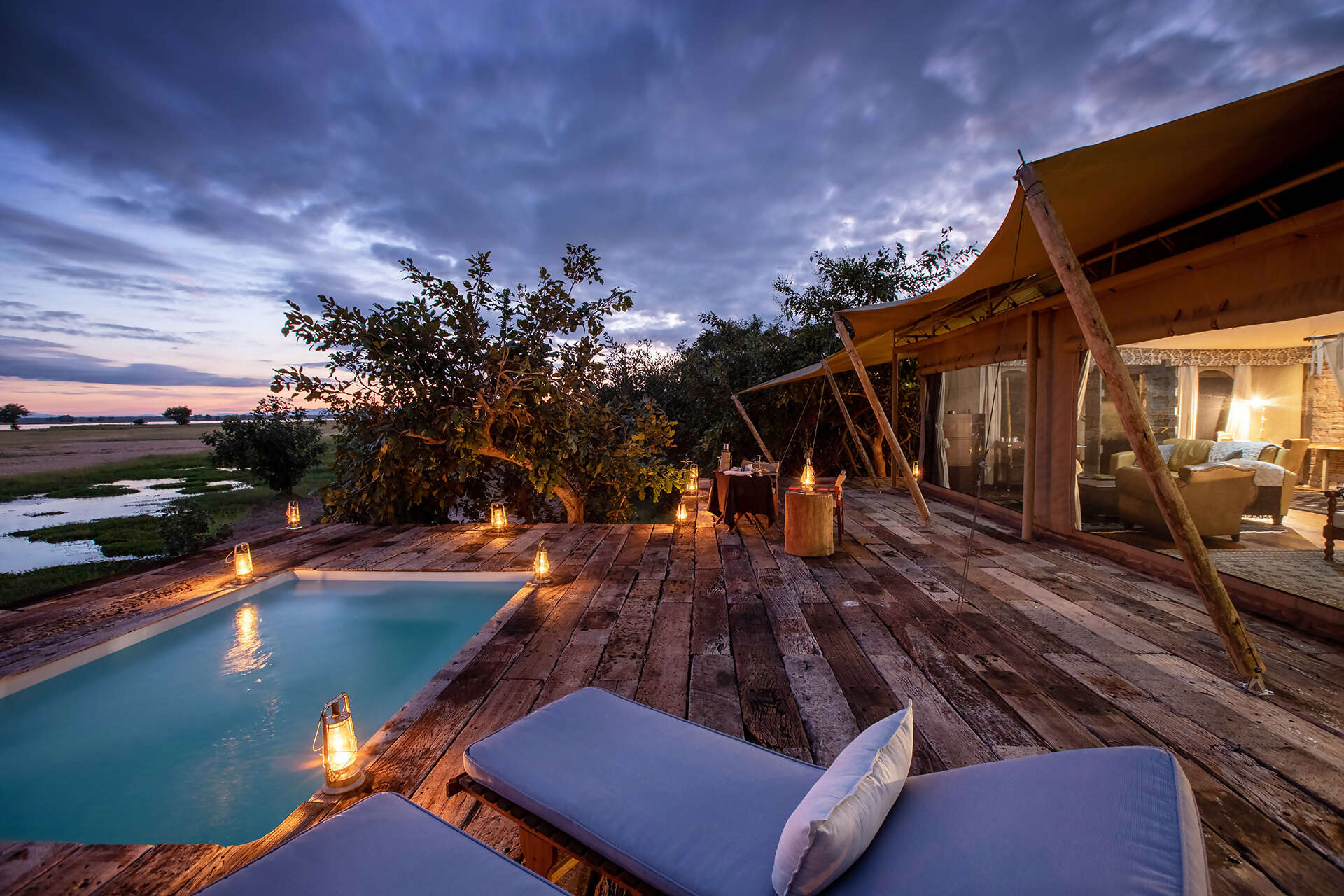 10Great-Plains-Tembo-Plains-Camp-guest-suite-deck-at-night.jpg