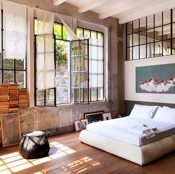 With 13-foot high ceilings and wide iron windows, Superhost Marco’s Airbnb Plus home is the canvas for his creativity