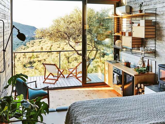 Superhosts Antonis and Sofia’s 344 square-foot cliffside home is proof that living small can still be luxurious