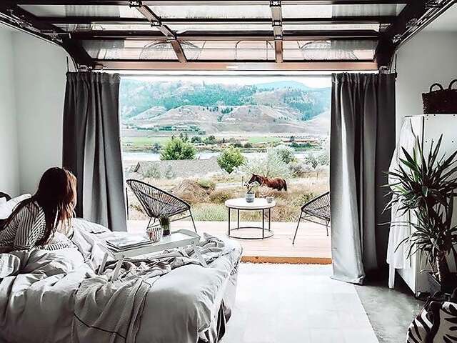 At Superhost Catherine’s cozy studio, your front door is a wall that opens up onto the Shuswap Highland and the South Thompson Ri